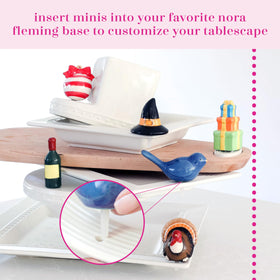 Nora Fleming Champagne Mini A94 interchangeable design shown with other minis.