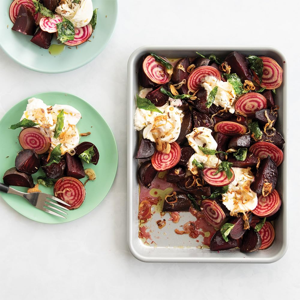 Nordic Ware Brilliant Color with reinforced steel rim resists warping during roasting