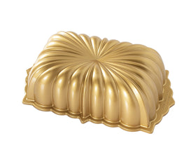 Nordic Ware classic fluted Bundt pan in gold for detailed cake designs.