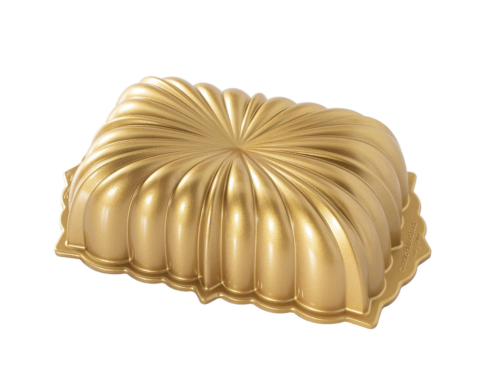 Nordic Ware classic fluted Bundt pan in gold for detailed cake designs.