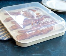 Nordic Ware cooking surface is 9.1 by 9 inches for even browning.