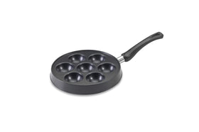Nordic Ware Danish Ebelskiver Pan on stove showing even heating for fluffy pancakes