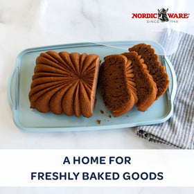 Nordic Ware loaf cake keeper lid, snaps securely to preserve crusty bread.