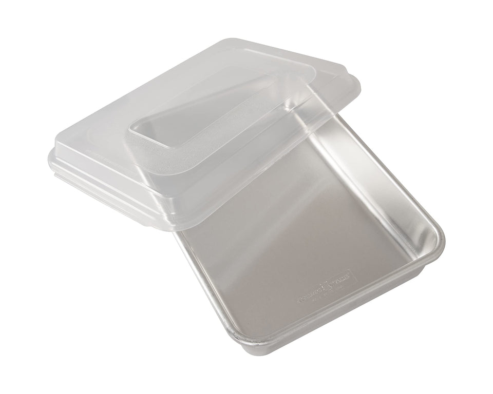 Nordic Ware 9x13 cake pan with lid showing sturdy aluminum for even browning.
