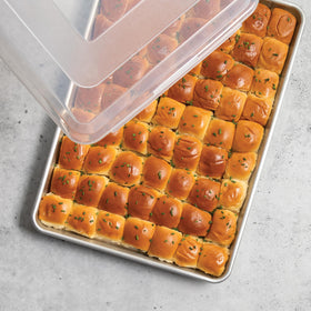 Nordic Ware Naturals Big Batch Pan with lid, keeps baked goods fresh during transport.