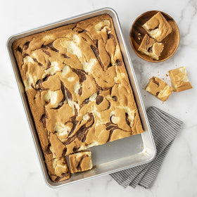 Nordic Ware Naturals high-sided pan interior enables even heat for baking.