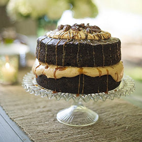 Nordic Ware Naturals round cake pan highlights heat-conductivity for uniform layers.