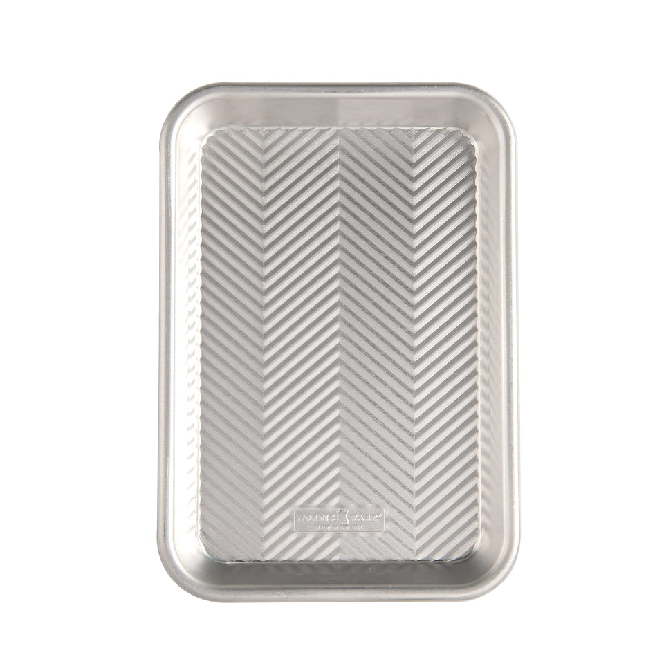 Nordic Ware Prism eighth sheet front view showing even browning with natural aluminum