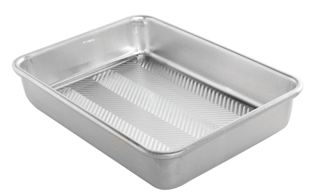 Nordic Ware Prism baking pan 9x13 front view showing even browning and sturdy construction.
