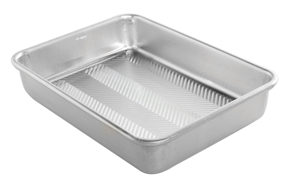 Nordic Ware Prism baking pan 9x13 front view showing even browning and sturdy construction.