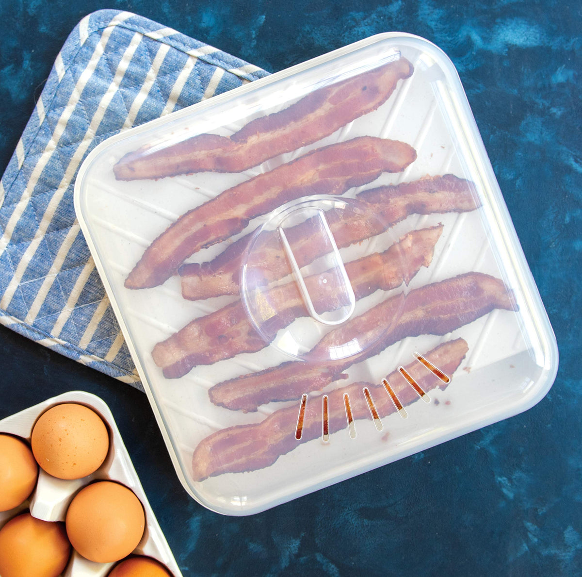 Nordic Ware vented lid prevents splatter while keeping food warm.