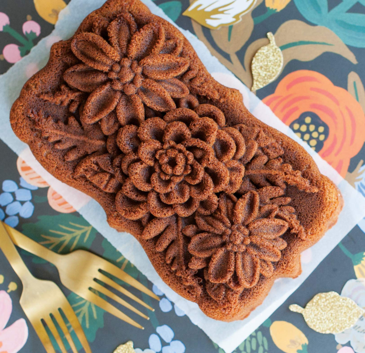 Nordic Ware Wildflower Loaf Pan cast aluminum body ensures fast heat transfer.