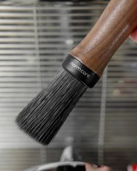 Normcore Barista Brush with black oak handle for stylish, ergonomic use.