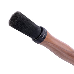 Normcore Barista Brush in use beside espresso grinder to sweep grounds.