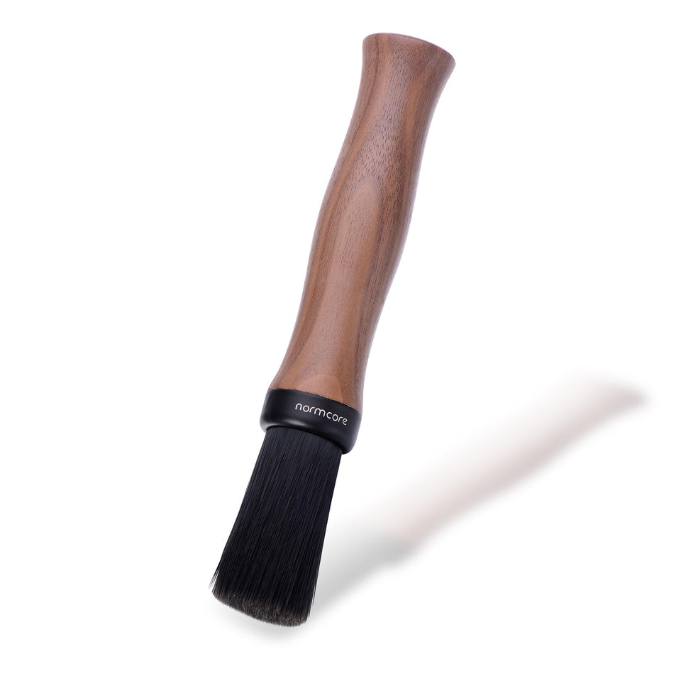 Normcore Barista Brush with walnut handle for a comfortable cleaning grip.