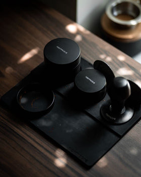 Normcore Built-In Tamp Stand holds your tamper within reach for quick switching.