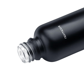 Normcore RDT spray bottle on countertop; compact 30ml capacity