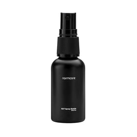 Normcore RDT spray bottle beside espresso setup for smoother prep