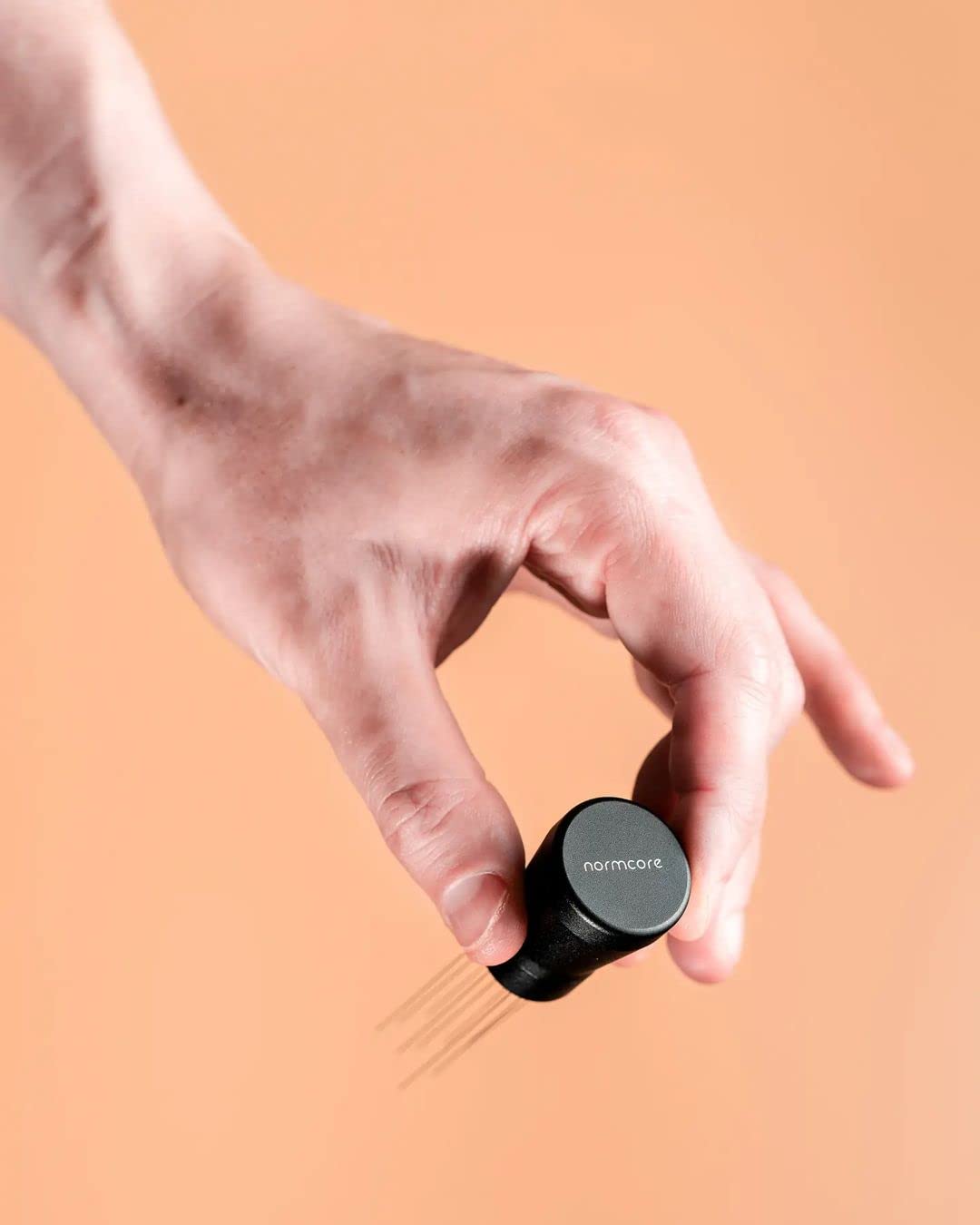 Normcore WDT distribution tool showing magnet handle for quick stowage beside the machine