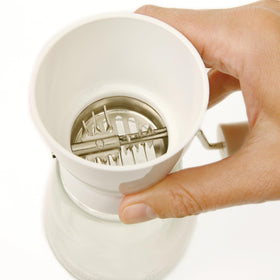 Norpro Nut/Topping Chopper glass base keeps chopped toppings neatly gathered.
