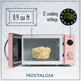 Nostalgia 800-watt microwave with digital clock display for quick heating