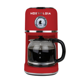 Nostalgia Classic Retro 10-cup coffee maker on counter in red for quick home brews.