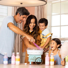 Nostalgia aqua cotton candy maker on countertop, family-friendly centerpiece