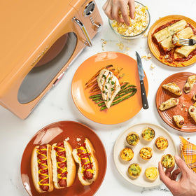 Nostalgia orange rotating carousel ensures even heating for leftovers.