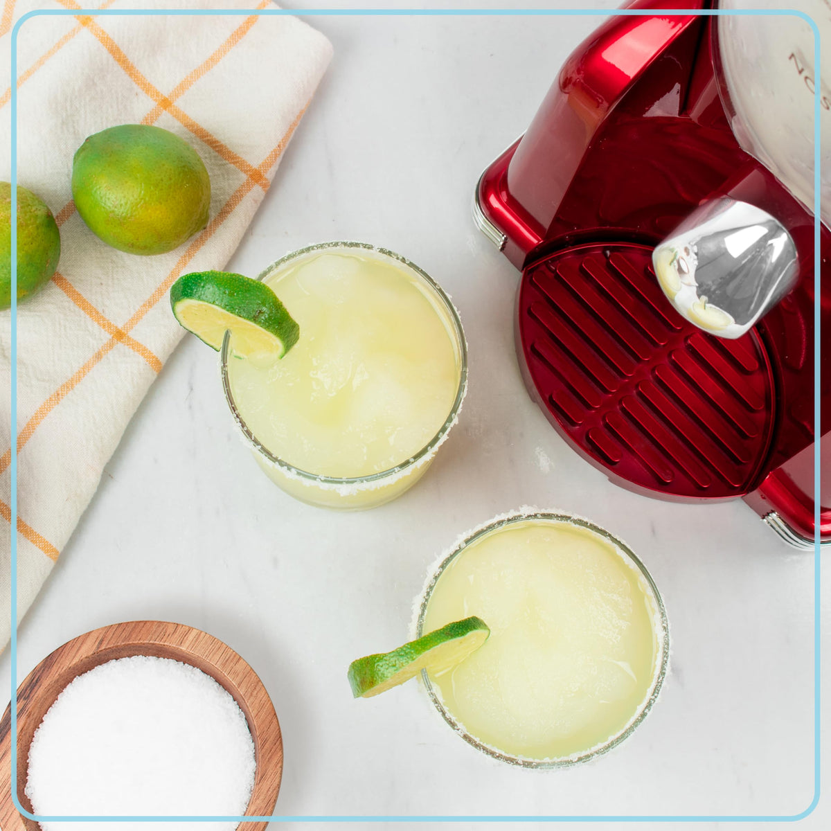 Nostalgia frozen drink maker includes cup rest and drip tray for mess-free serving.