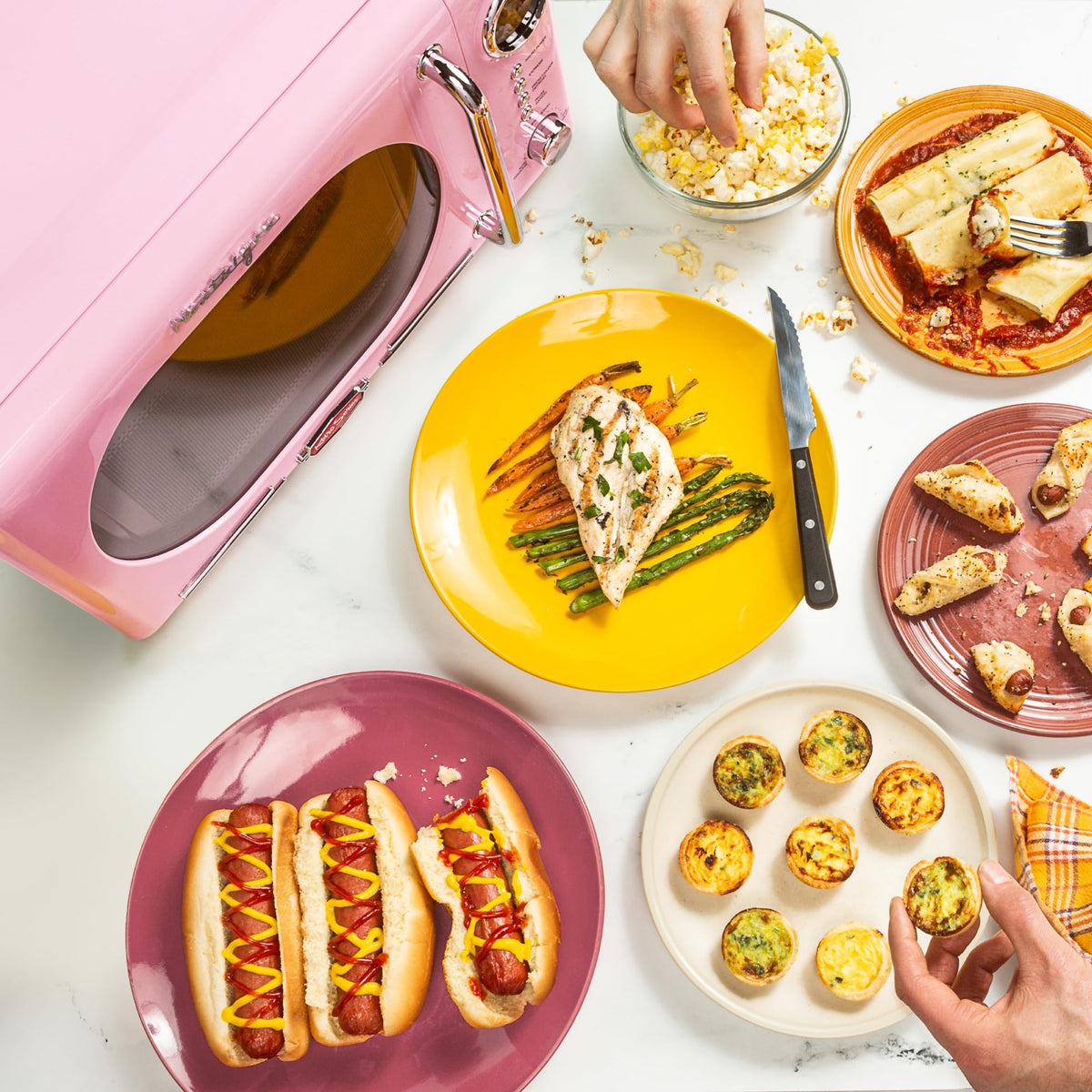 Nostalgia microwave pink interior view emphasizes easy-to-clean interior features.