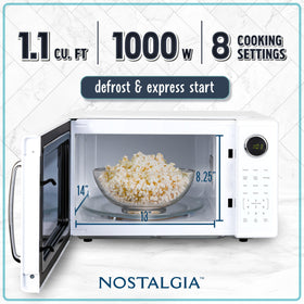 Nostalgia Retro 1000W microwave control panel closeup, easy-to-use buttons for precise settings.