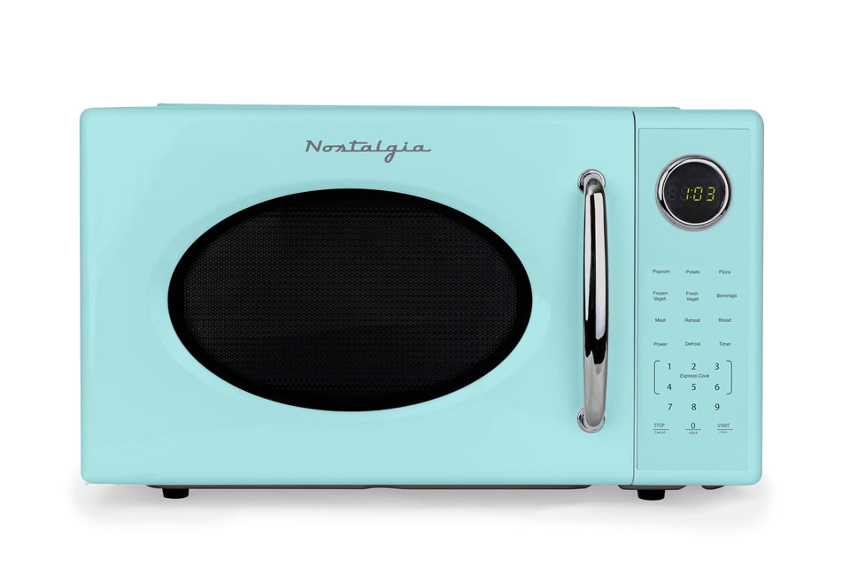 Nostalgia Retro 1000W microwave front view showing compact, stylish countertop design