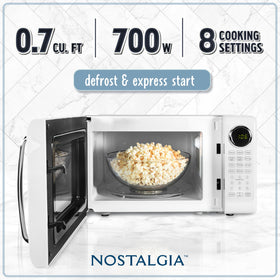 Nostalgia retro microwave oven control panel with intuitive buttons for easy operation.