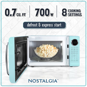 Nostalgia retro microwave oven control panel with easy buttons for quick heating and defrost.