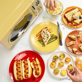 Nostalgia retro microwave yellow interior, 0.9 cu ft for versatile snacks.