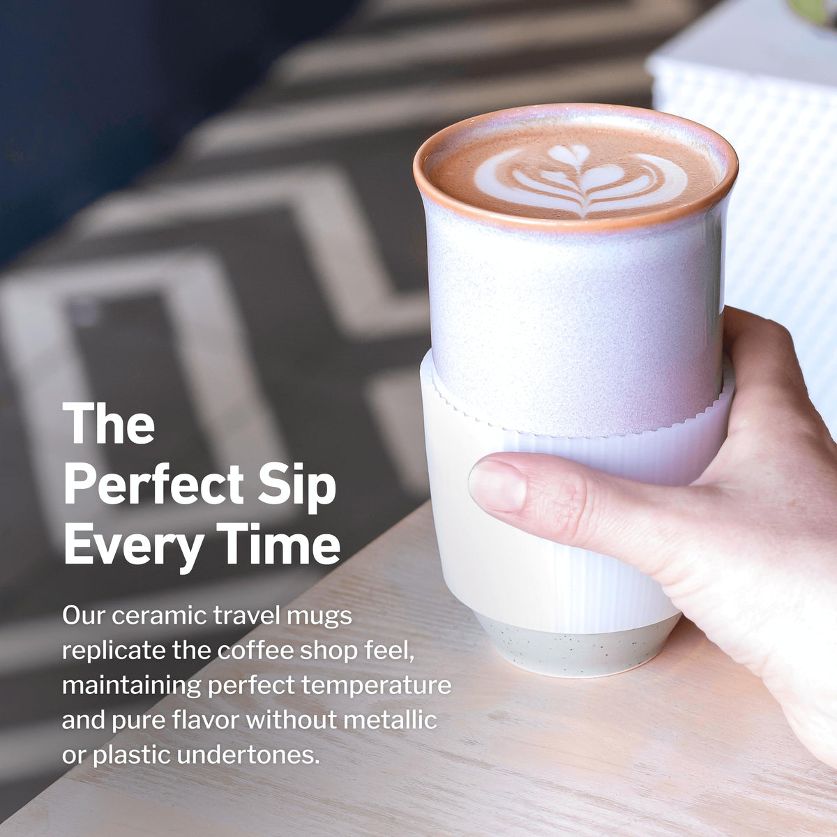 NOVA CERAMICS coffee travel mug in hand, emphasizing comfortable grip and ergonomic size.