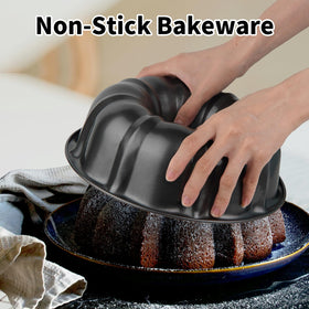 Novery round cake pan with large center tube promotes even heat distribution.