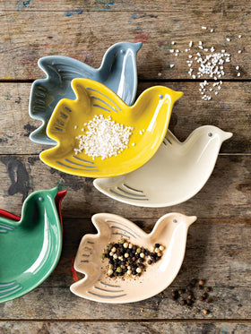 Now Designs multicolored bird ceramic dishes shown together for serving and prep.