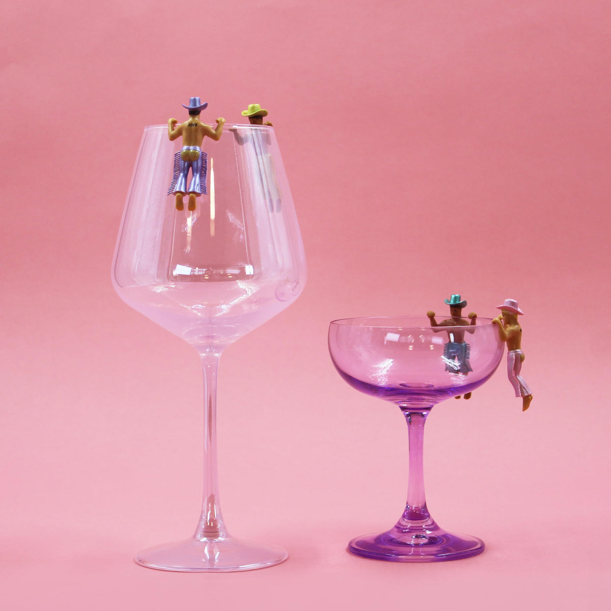 Groovy charm perched on a wine glass for a fun vibe.