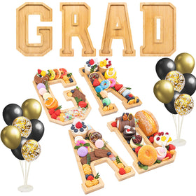 Nsoyos grad charcuterie letters on table create a stylish centerpiece.