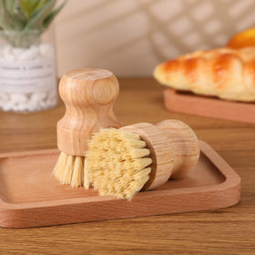 Nuenen bamboo dish scrub brush close-up highlighting ergonomic, non-slip handle.