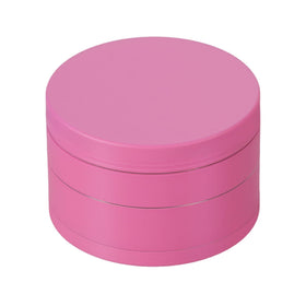 Nuovoware pink spice grinder with compact design for easy kitchen use.