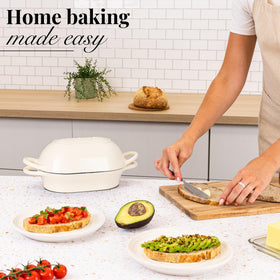 Nuovva cream Dutch Oven with extended handles for easy transport.