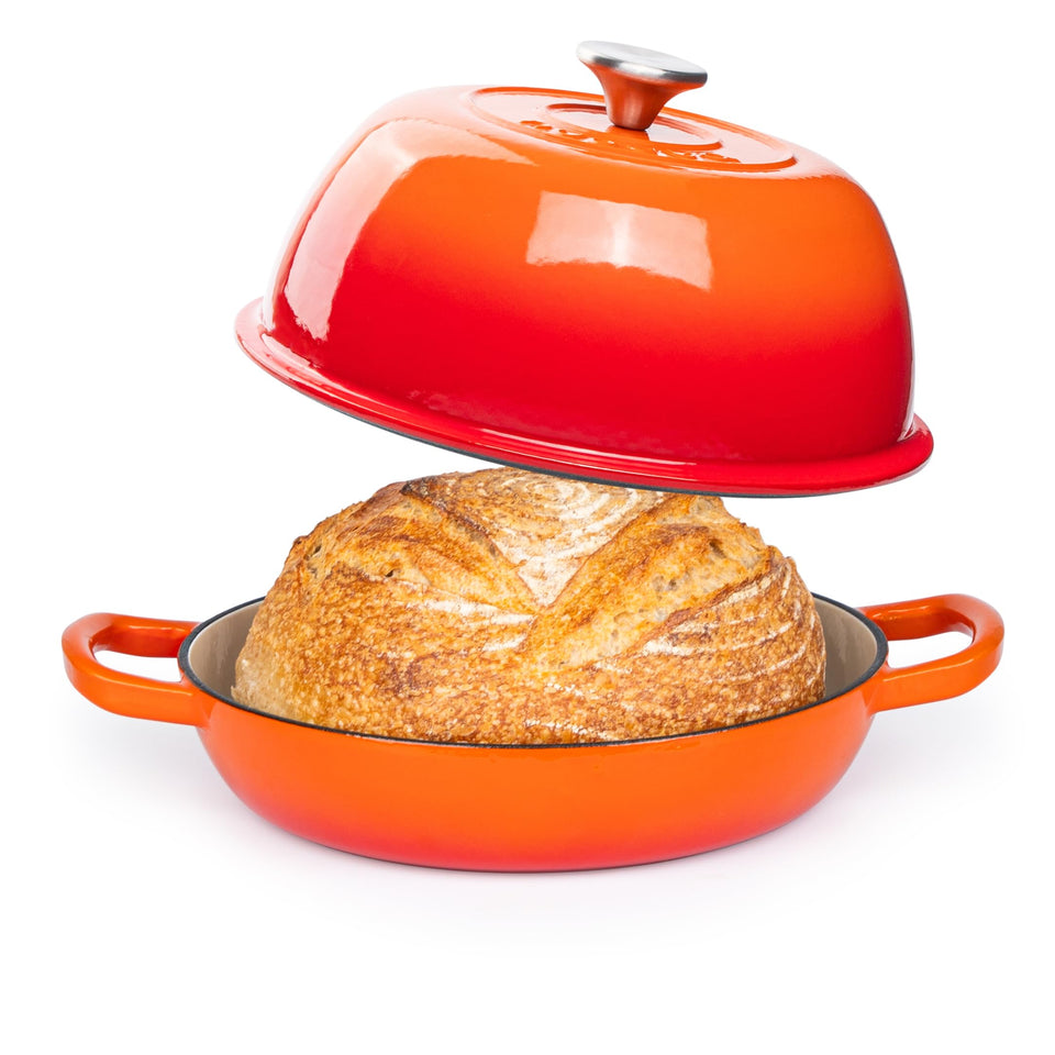 Nuovva enamelled cast iron Dutch oven orange with lid on for even heat distribution.