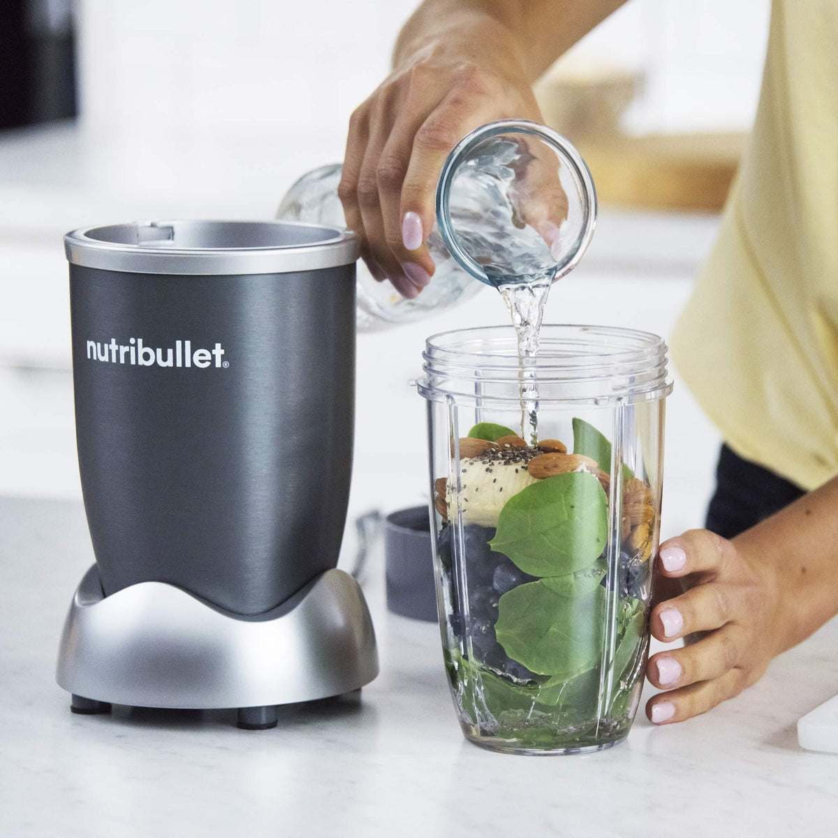 NutriBullet cup ring with handle for secure pouring.