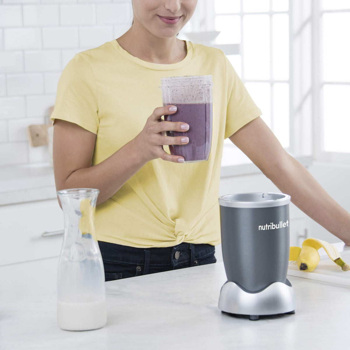 NutriBullet cup ring secures lids during blending.