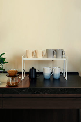 Nxconsu freestanding rack on countertop boosts storage space.