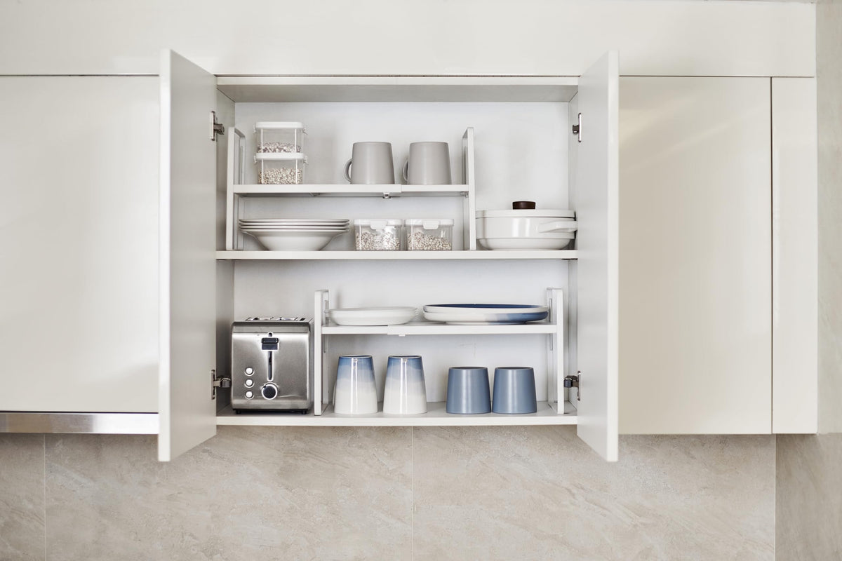 Nxconsu pantry storage solution keeps snacks and dishes accessible.