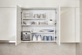 Nxconsu pantry storage solution keeps snacks and dishes accessible.