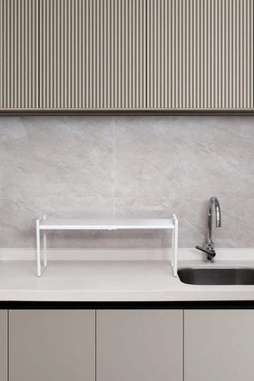 Nxconsu two-tier stackable setup for extra vertical storage.